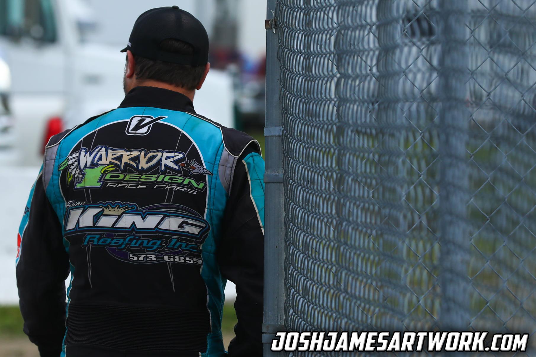 Ryan from behind in firesuit, walking toward the staging area