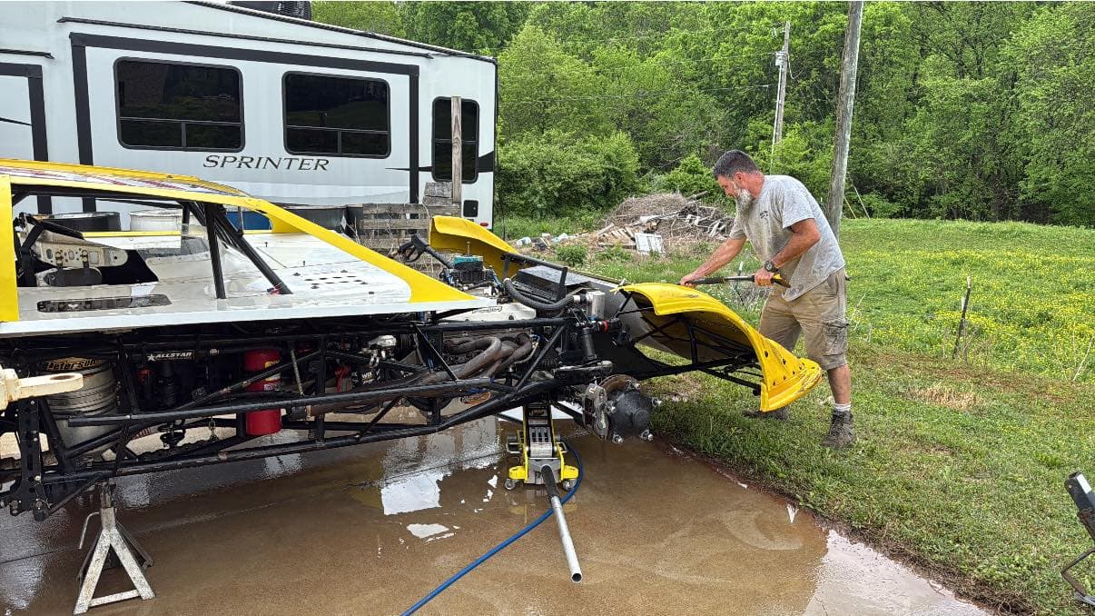 Kevin Lusby washing the bare chassis at the shop